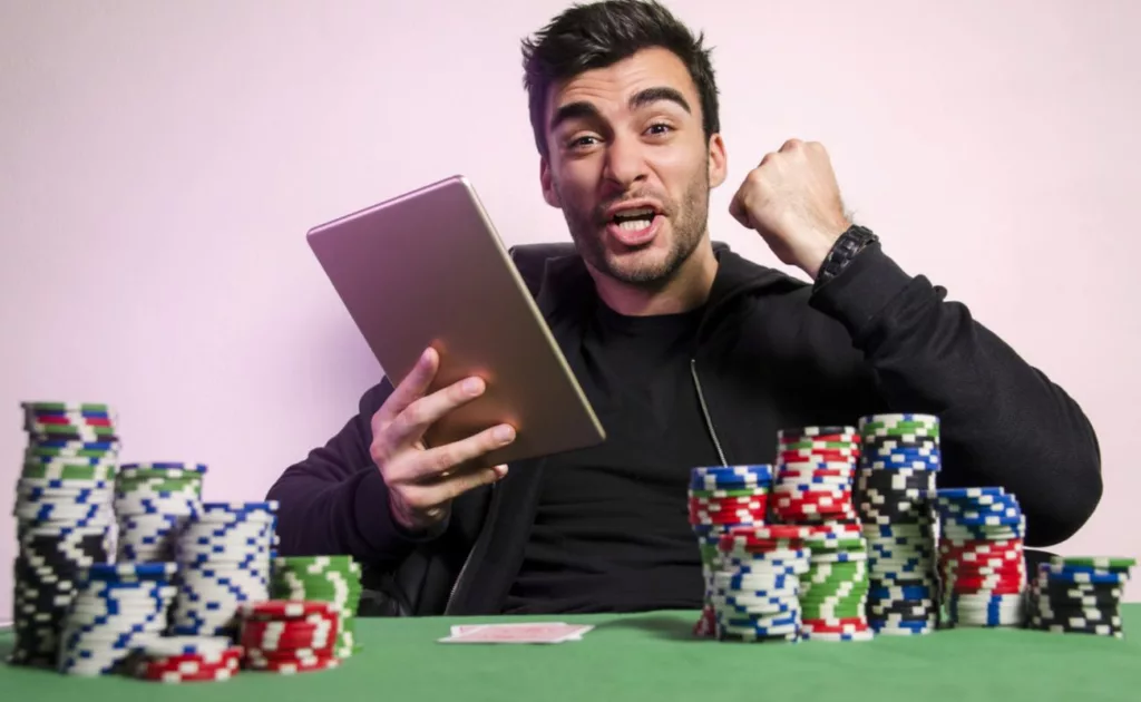 A man playing online casino games and winning real money with no deposit bonuses
